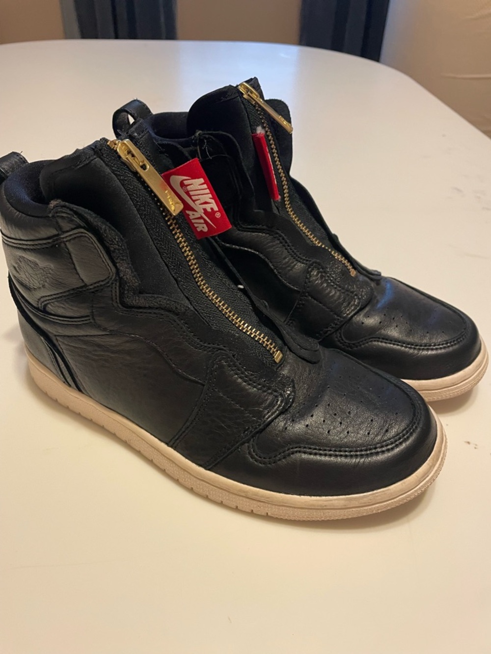 Women’s Nike Air Jordan Black Leather High-Top Sneakers with Gold Zipper